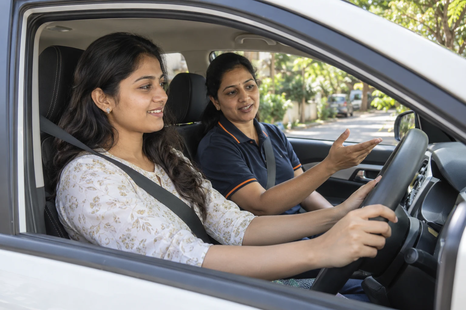 DriveMe instructor guiding a learner in a car